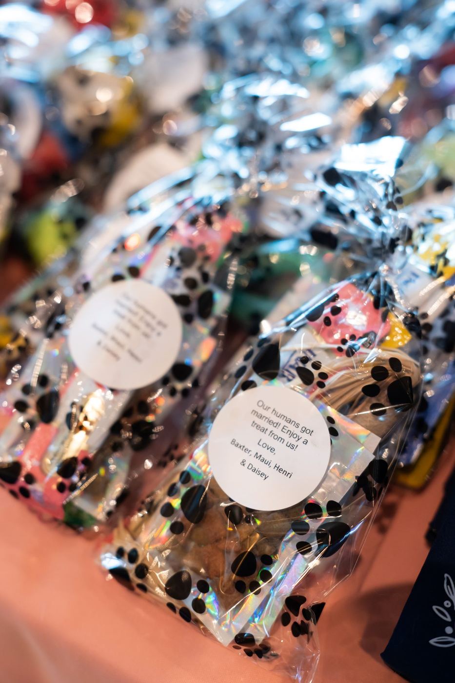 Paw-print bags of pet treats as wedding favors